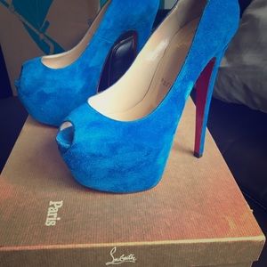 louboutin suede blue red bottoms .
